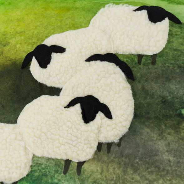 green-sofa-pillows-with-sheep