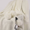 White pompon knitting blanket